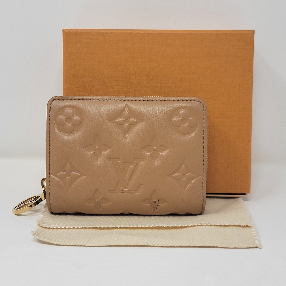 LOUIS VUITTON Lou Coussin Monogram Leather Bifold Wallet